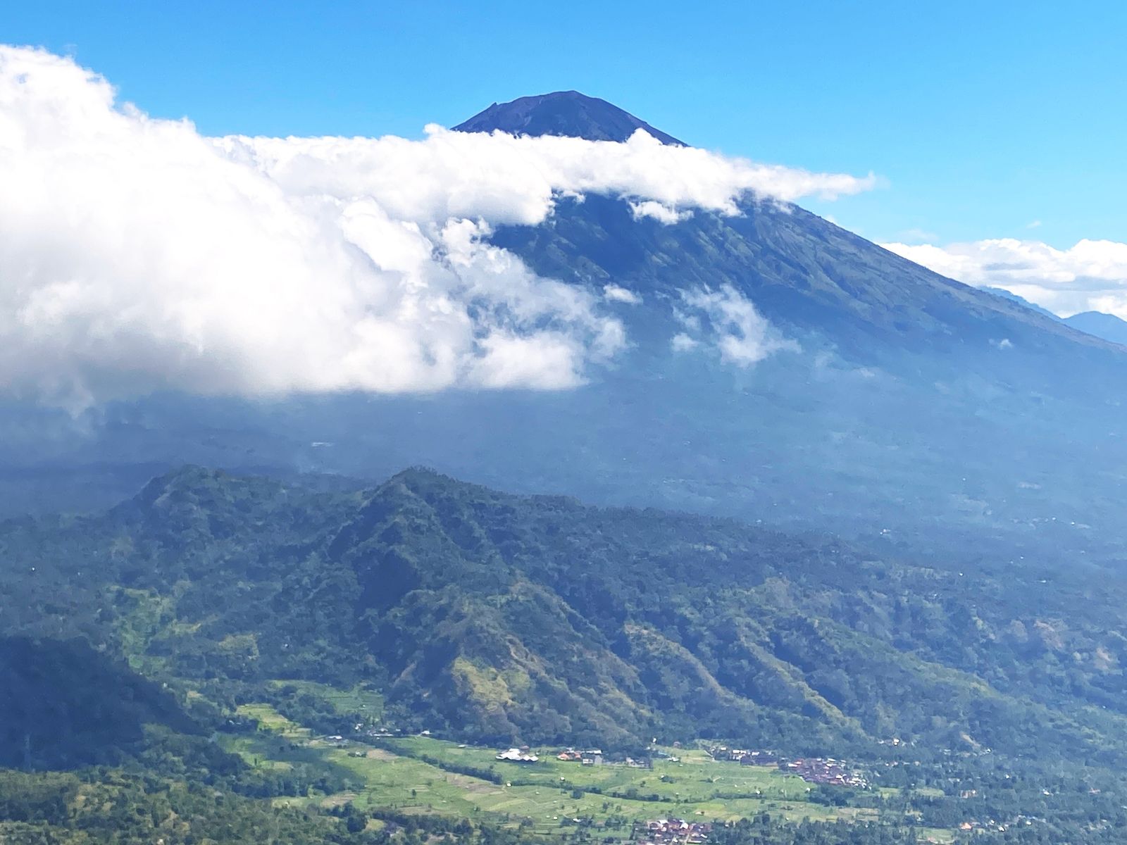 Gunung Agung, Bali's tallest and most sacred volcano, rising above surrounding terrain