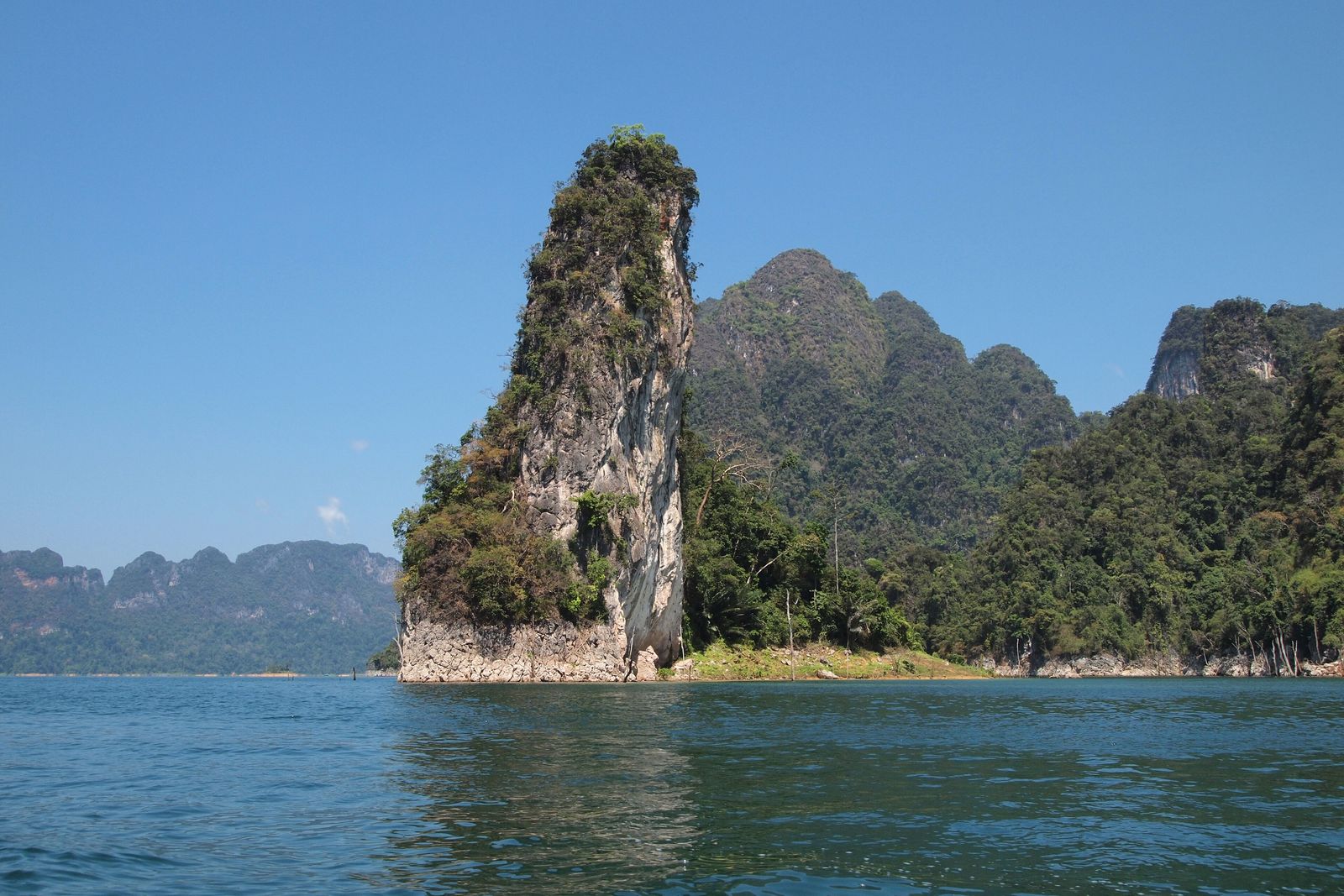 A floating bungalow raft house on the still water of Cheow Lan Lake in Khao Sok National Park, Thailand