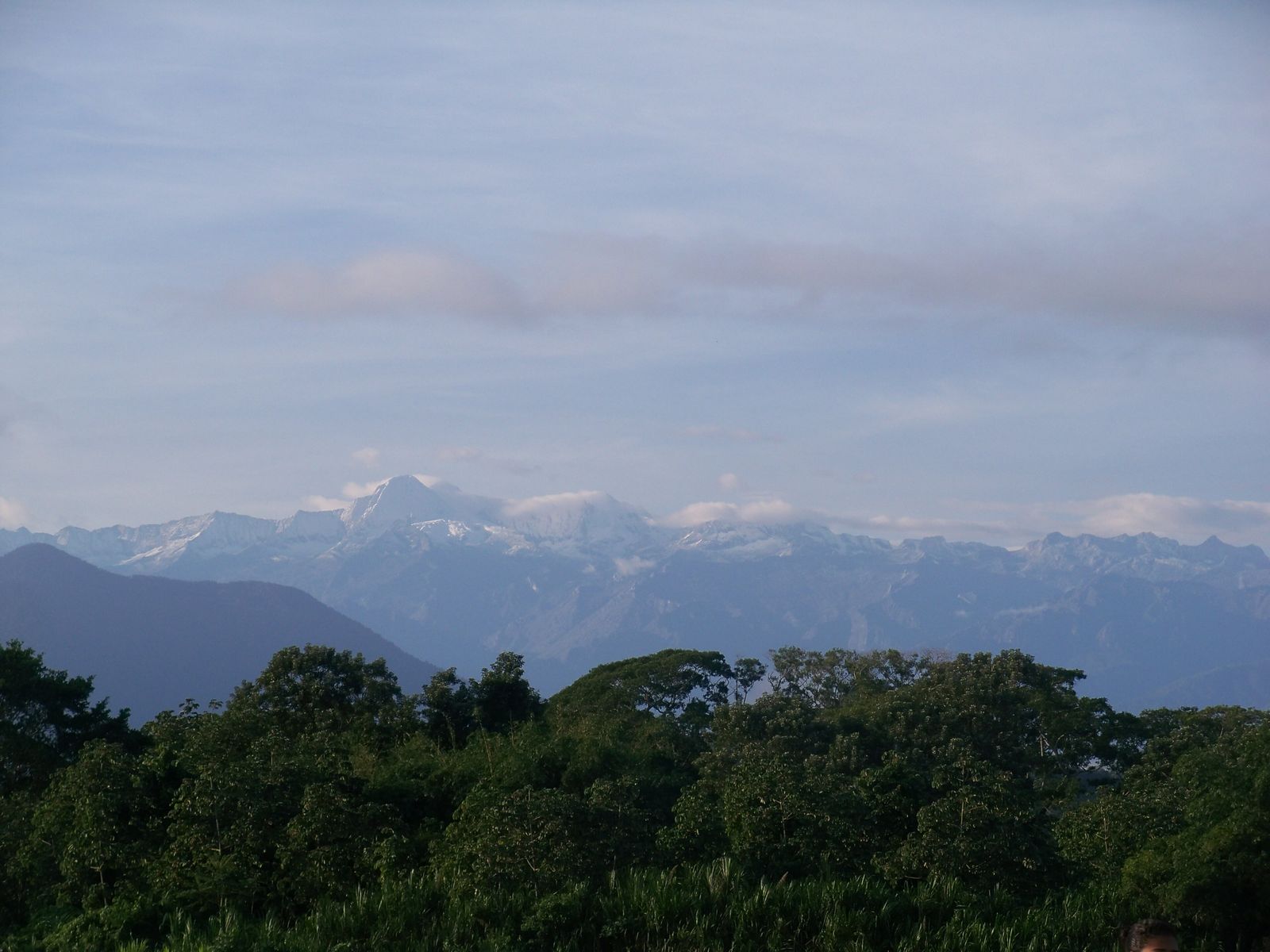 The green, cloud-forested slopes of the Sierra Nevada de Santa Marta rising above the Colombian Caribbean coast